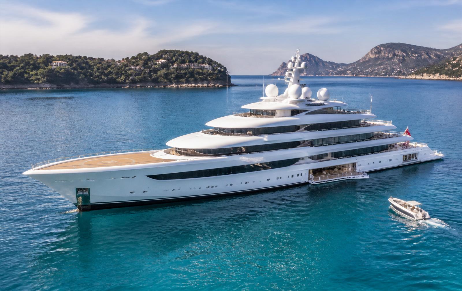 Oceanco-style superyacht anchored off the Mediterranean coast